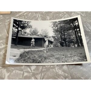 Vintage B&W Photo Young Woman Aiming Rifle Mid-Century Americana Kodak Snapshot